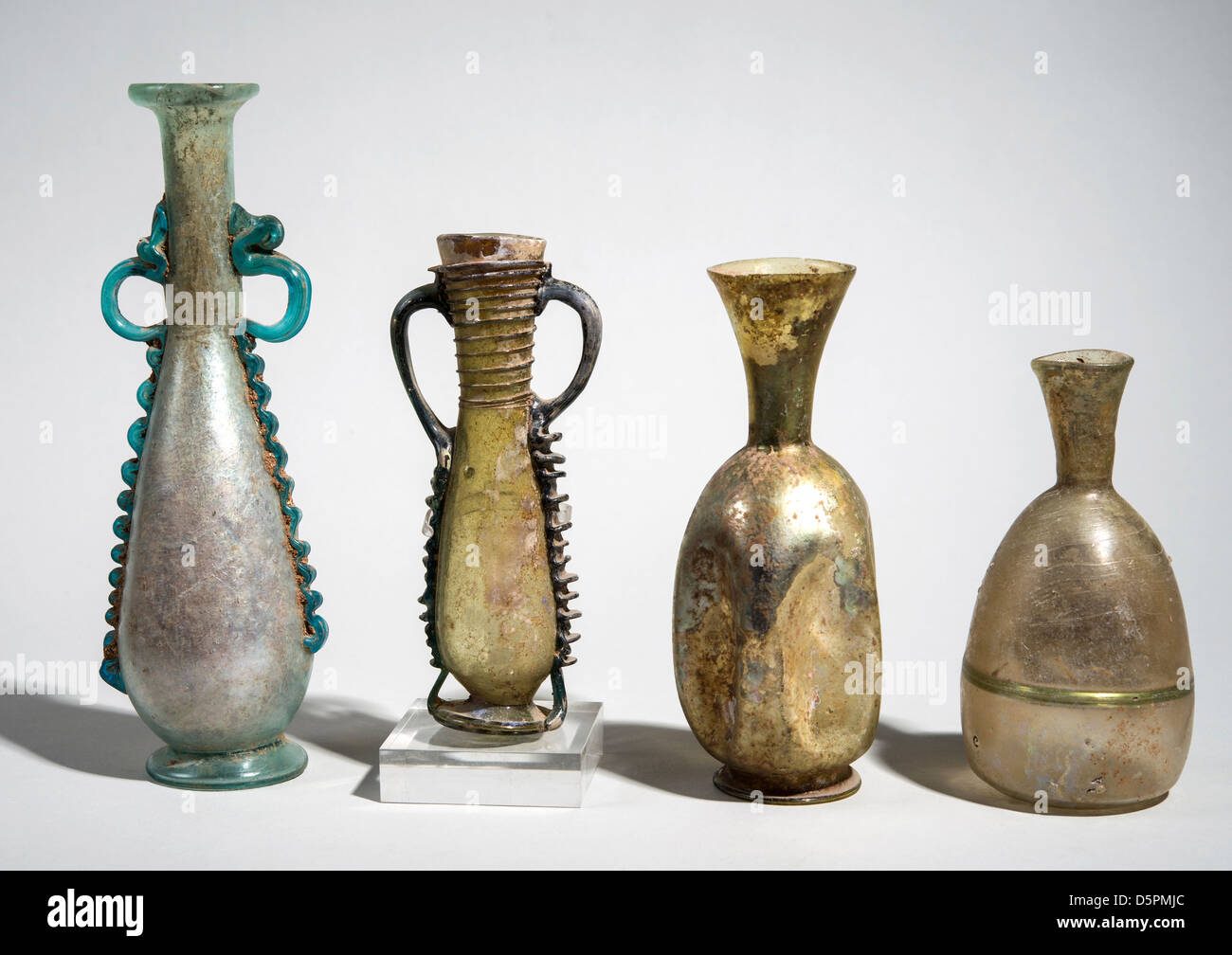 Decorated Roman Glass amphoras and bottles 3-4th century CE Stock Photo