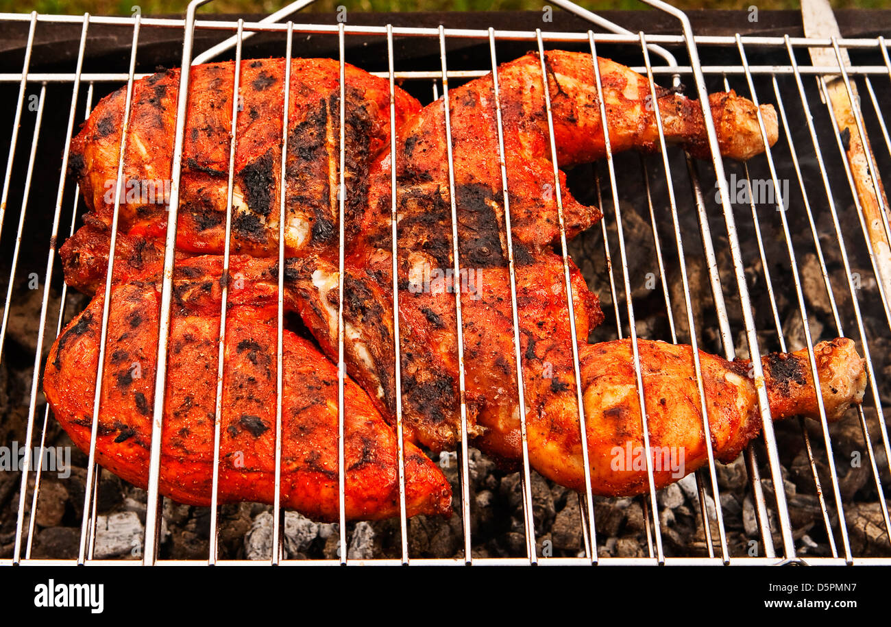 Indian style spicy chicken on grill Stock Photo Alamy