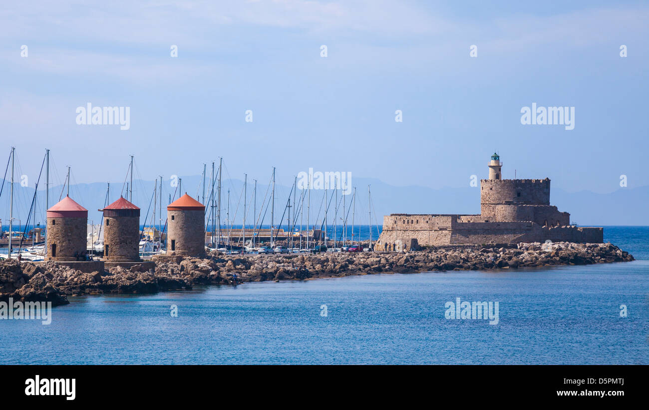 Mandraki Harbour windmills on the Island of Rhodes Greece Stock Photo