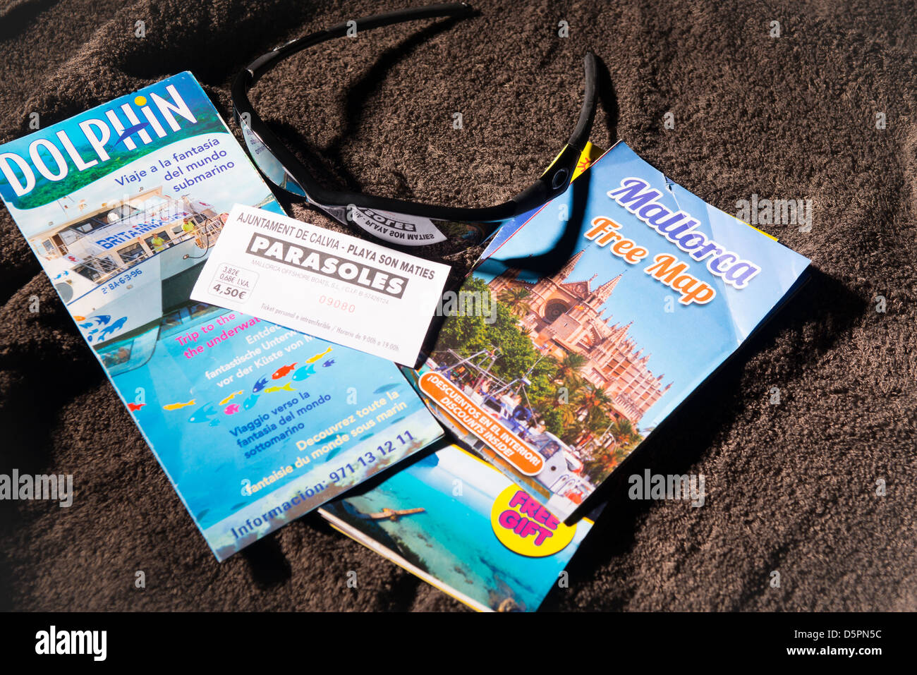 Mallorca holliday brochures on towel Stock Photo