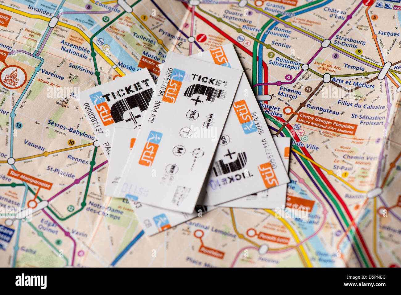 Paris metro tickets on subway plan Stock Photo