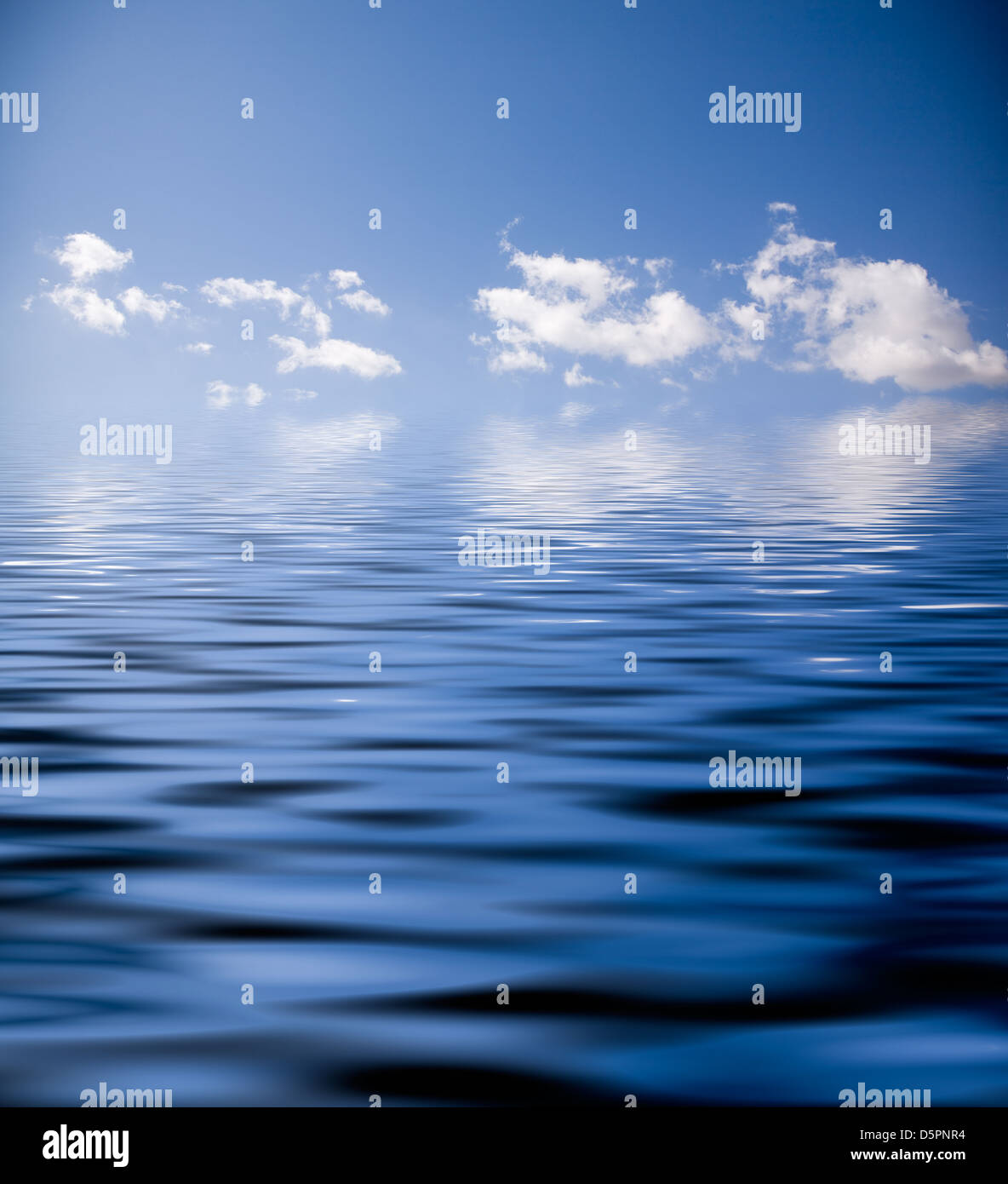 Blue sky with fluffy clouds and water reflection Stock Photo - Alamy