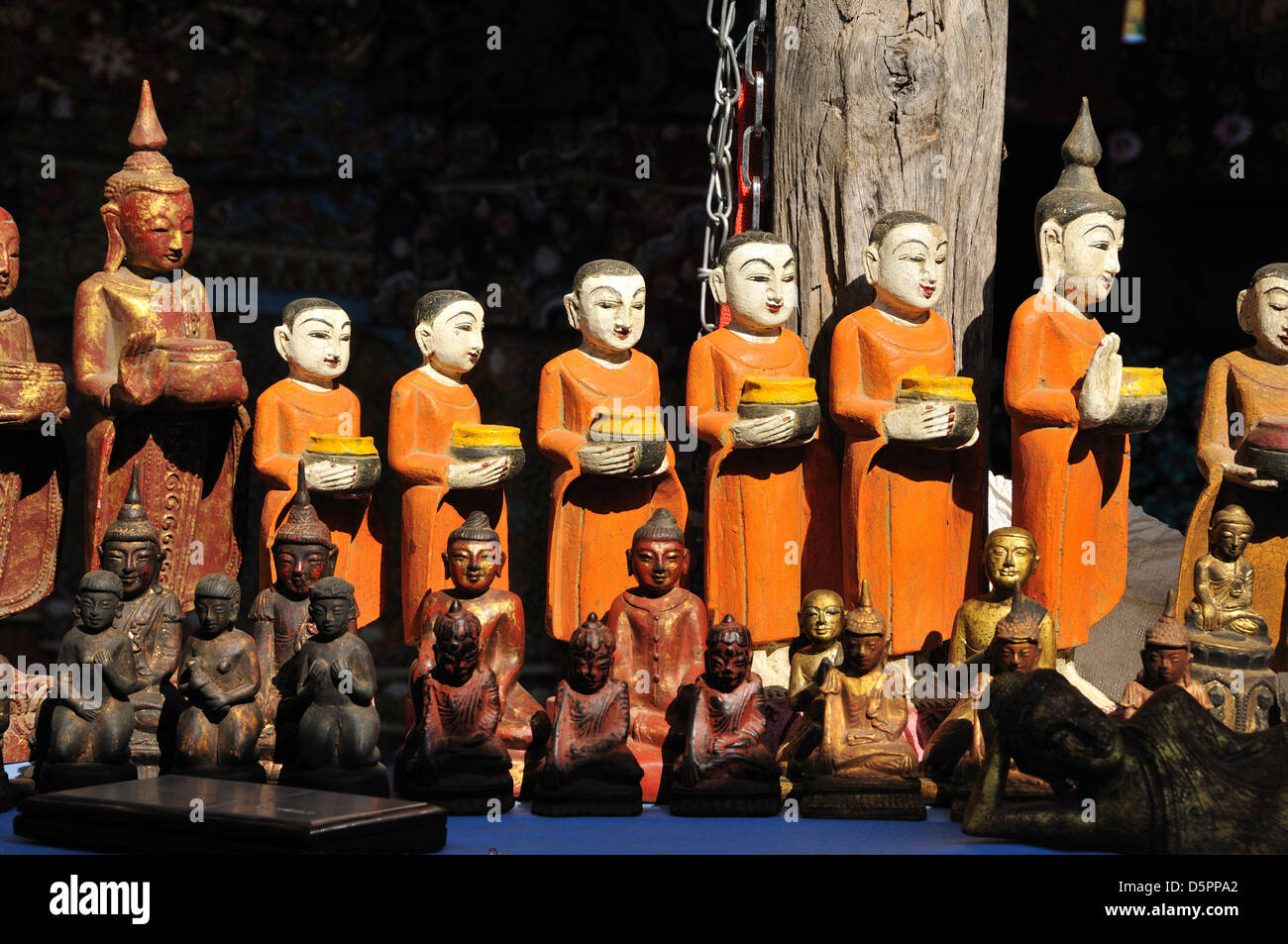 Monk with buddhist statues hi-res stock photography and images - Alamy