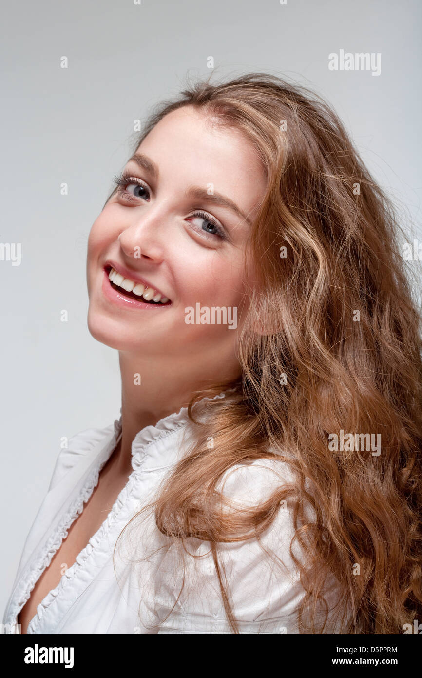 portrait of a young beautiful woman with brown hair smiling - isolated ...