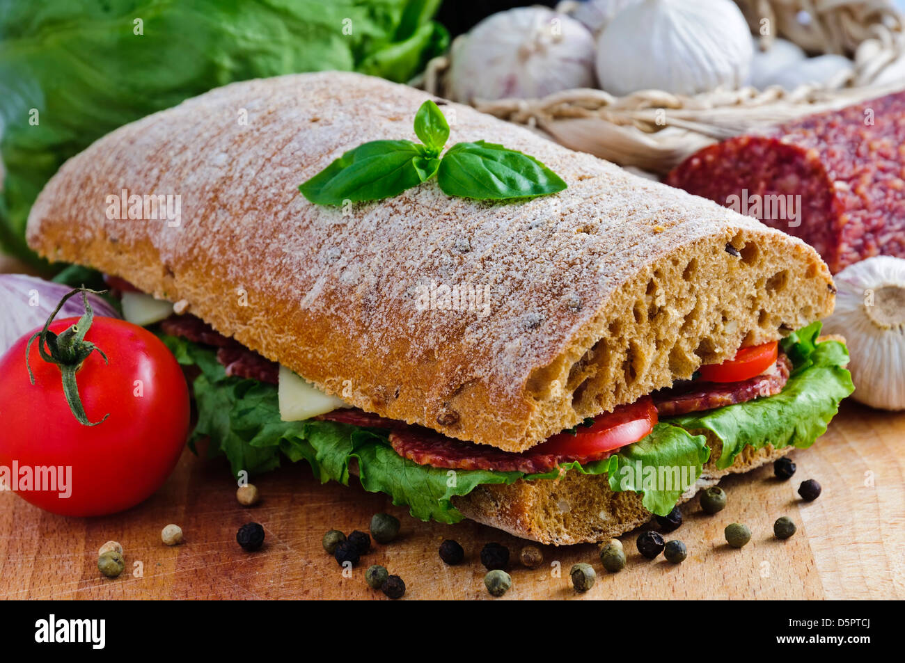 ciabatta sandwich with salami, cheese and vegetables Stock Photo Alamy