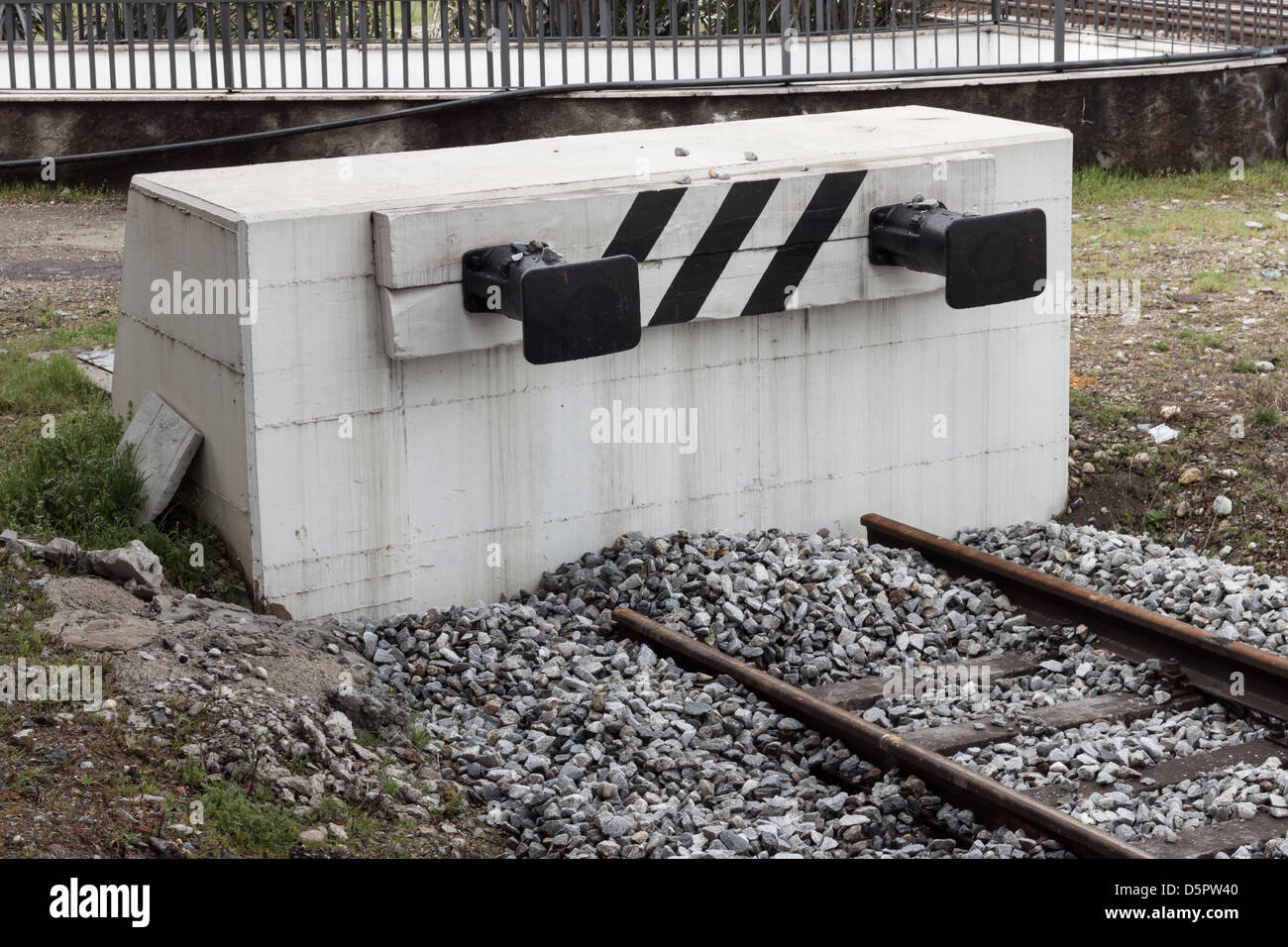 Dead-end track with buffer on a concrete structure Stock Photo
