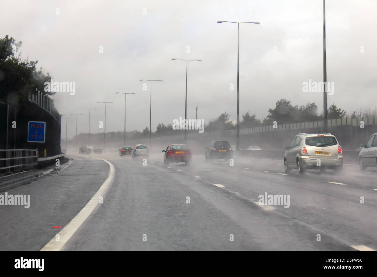Wet weather on the M25 motorway, Surrey England UK Stock Photo