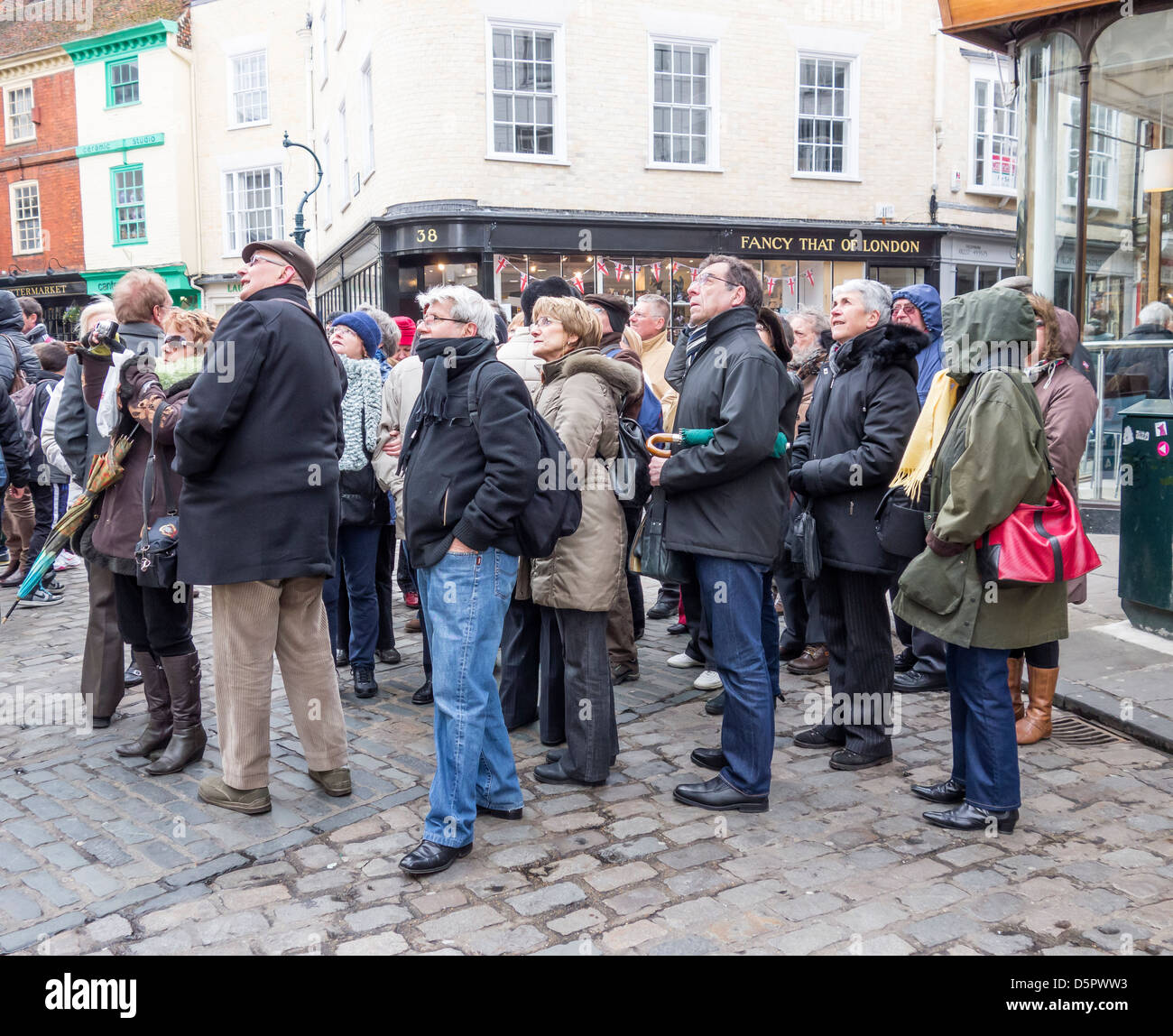 Canterbury Tourists Guided Tour outside the Cathedral Gate.  Buttermarket Canterbury Kent England UK Stock Photo