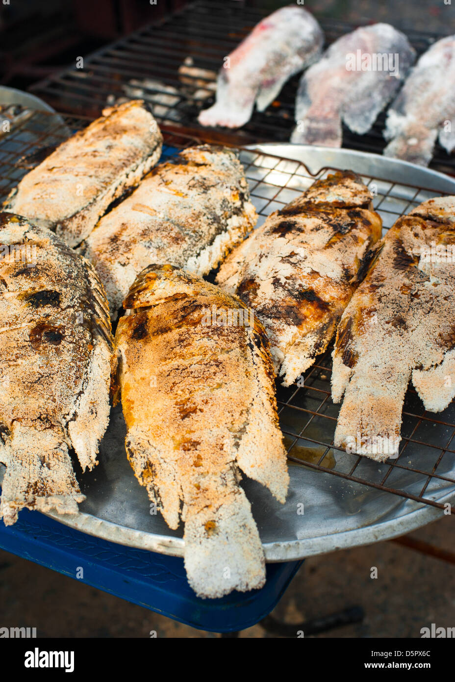 Traditional Thai food at market. Grilled salted fish Stock Photo