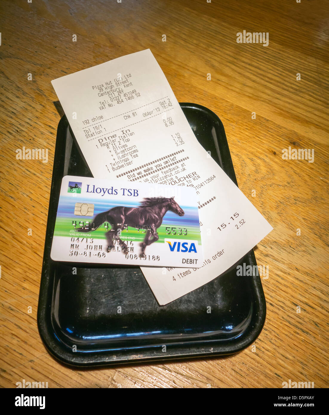 Pizza Hut Restaurant Food Bill and Visa Debit Card Stock Photo