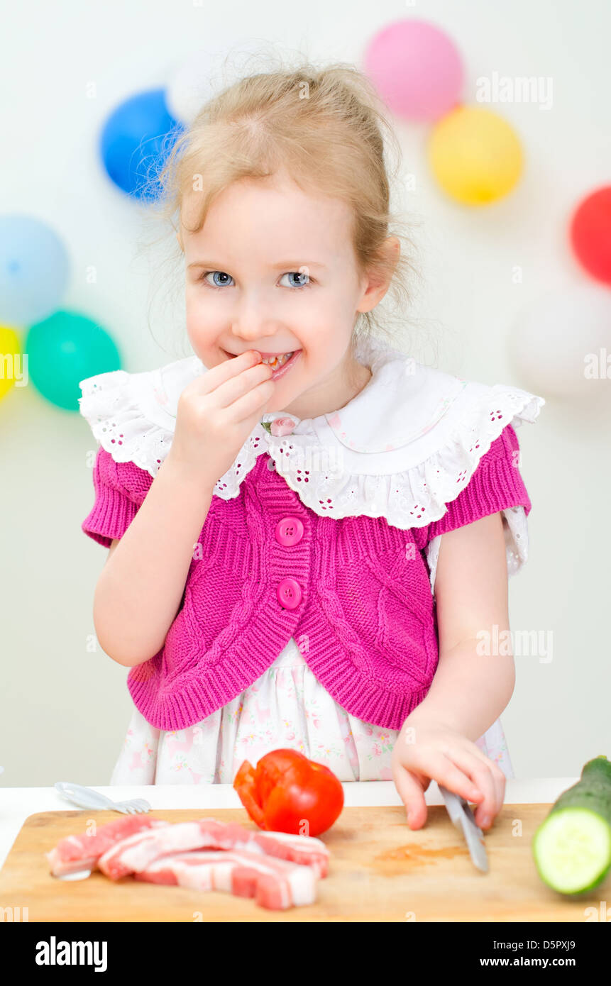 Little girl cooking dinner Stock Photo