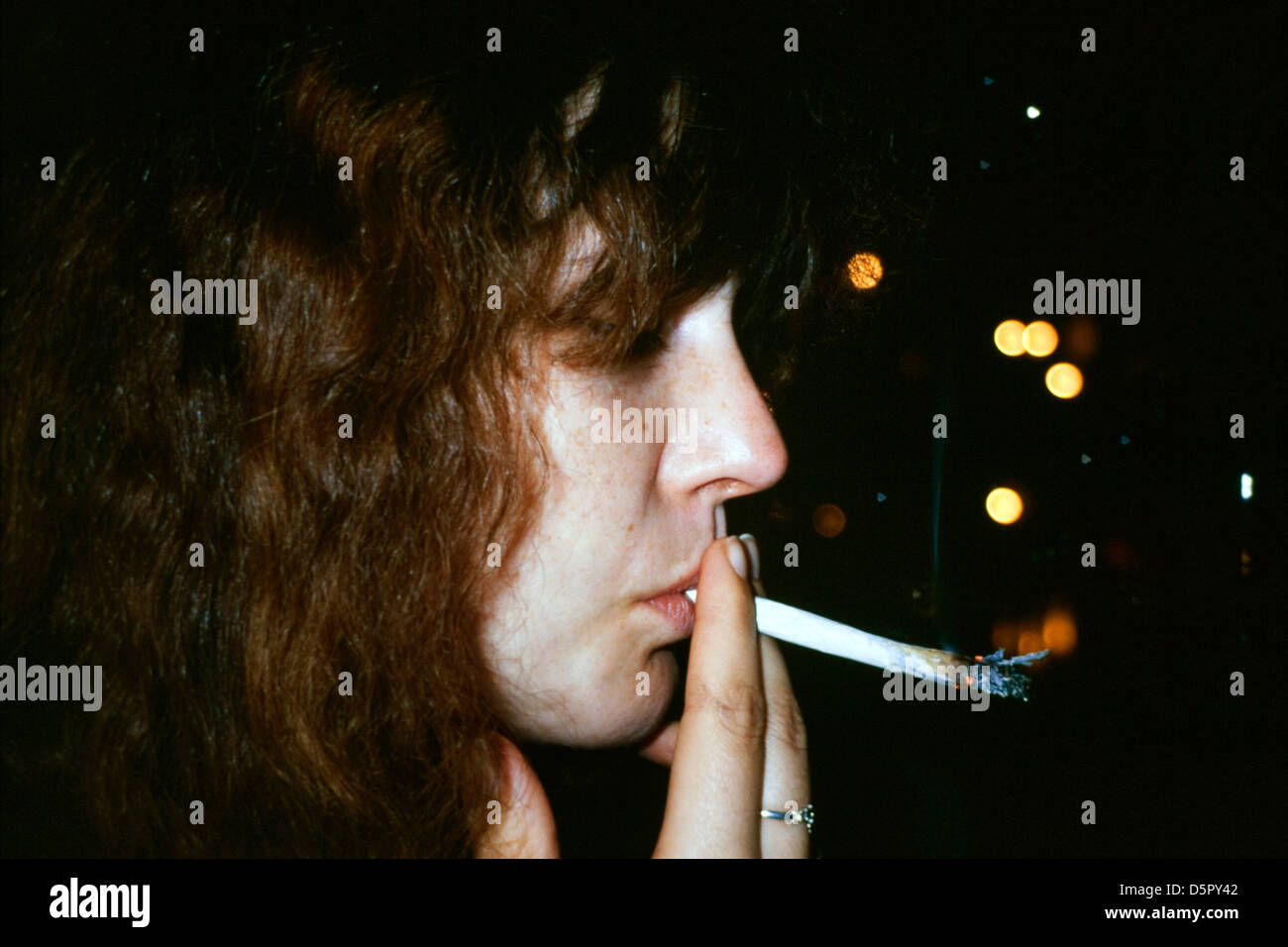 woman smoking a cannabis joint Stock Photo