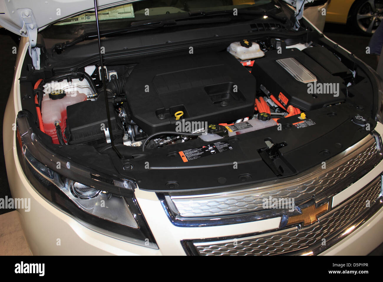 The engine in a GMC Chevy Chevrolet Volt electric hybrid automobile car Stock Photo