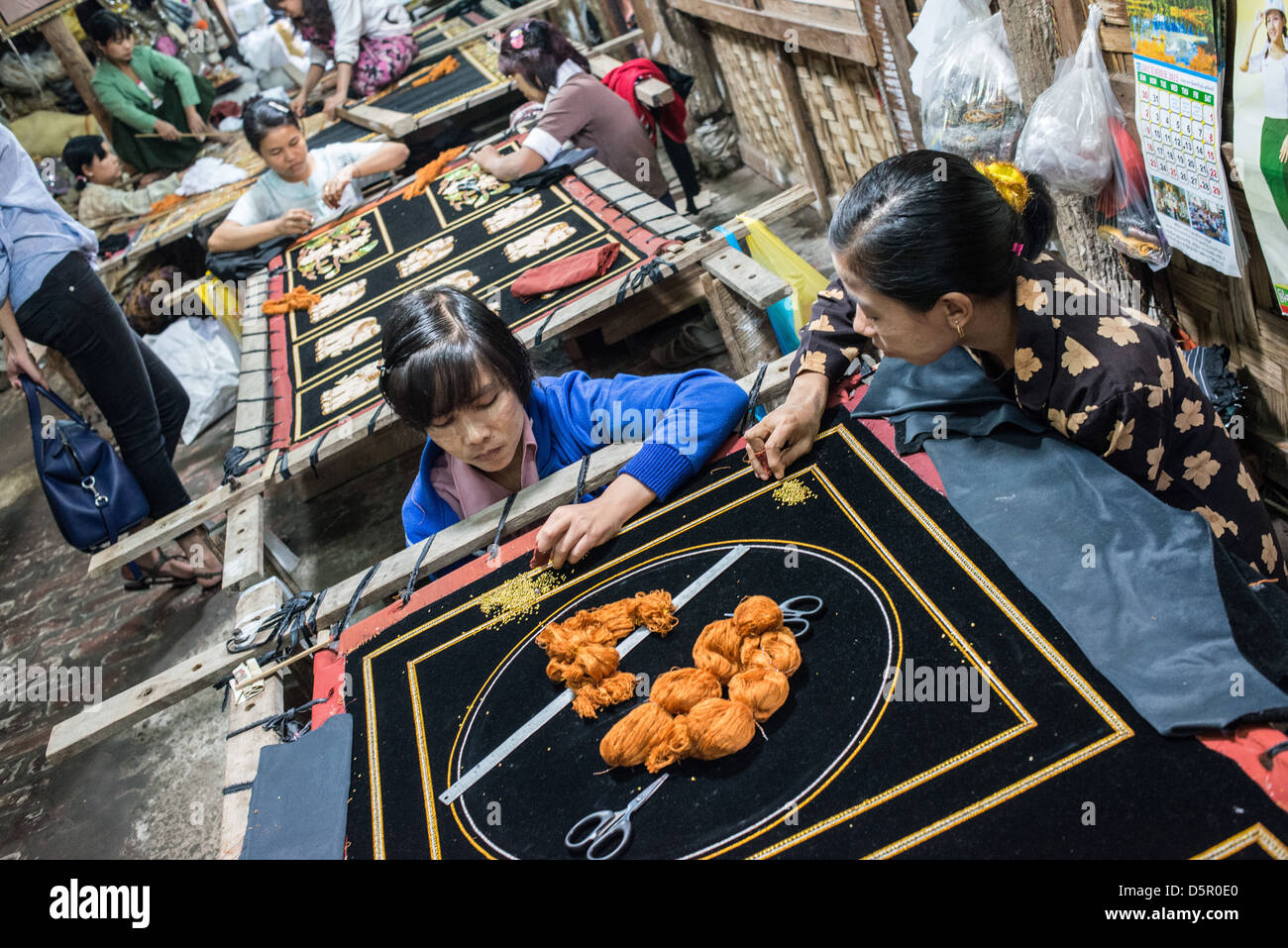 Women working at embroidery store in Myanmar. Stock Photo