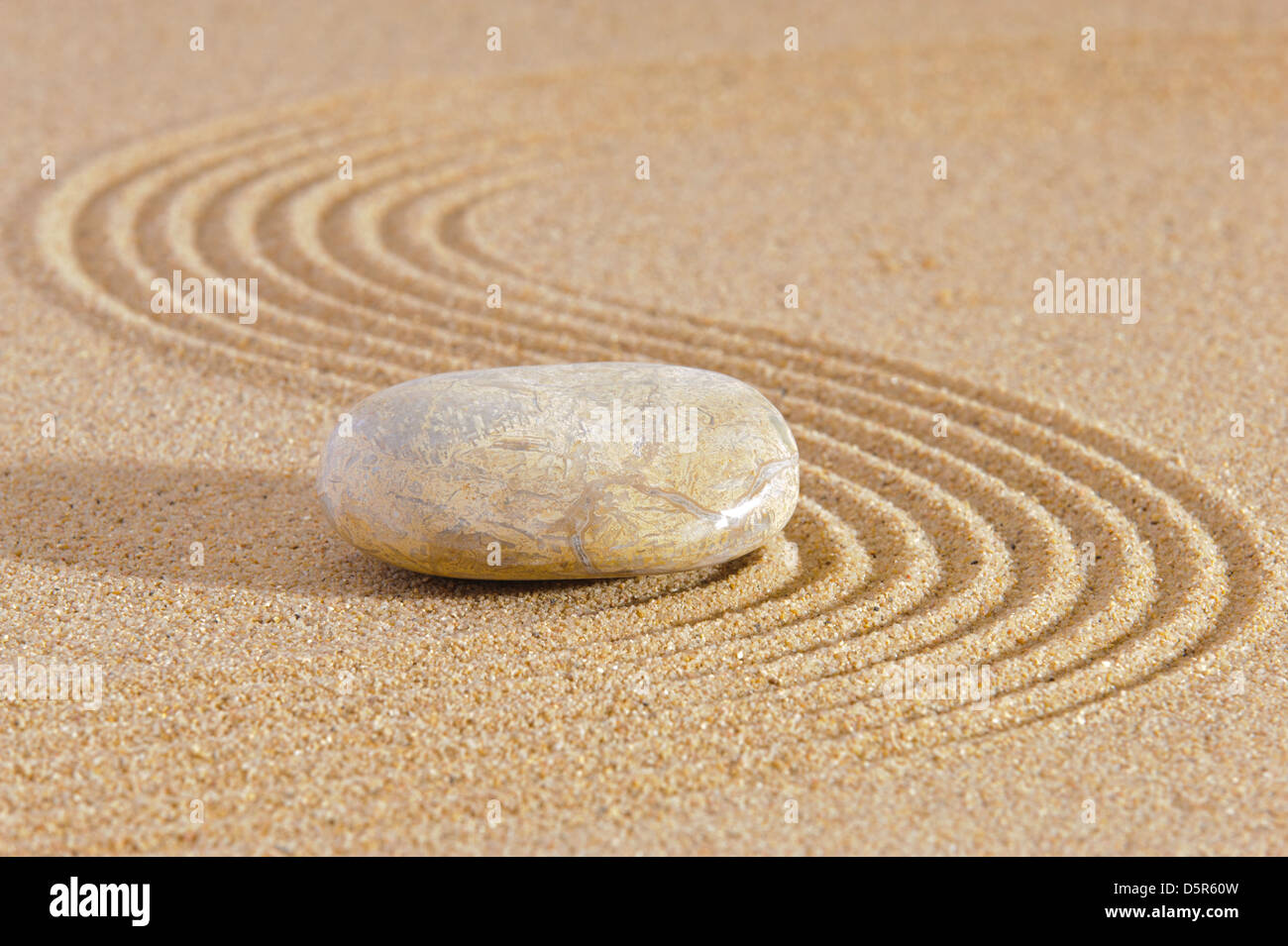 Japan zen garden of meditation with stone and structure in sand Stock Photo