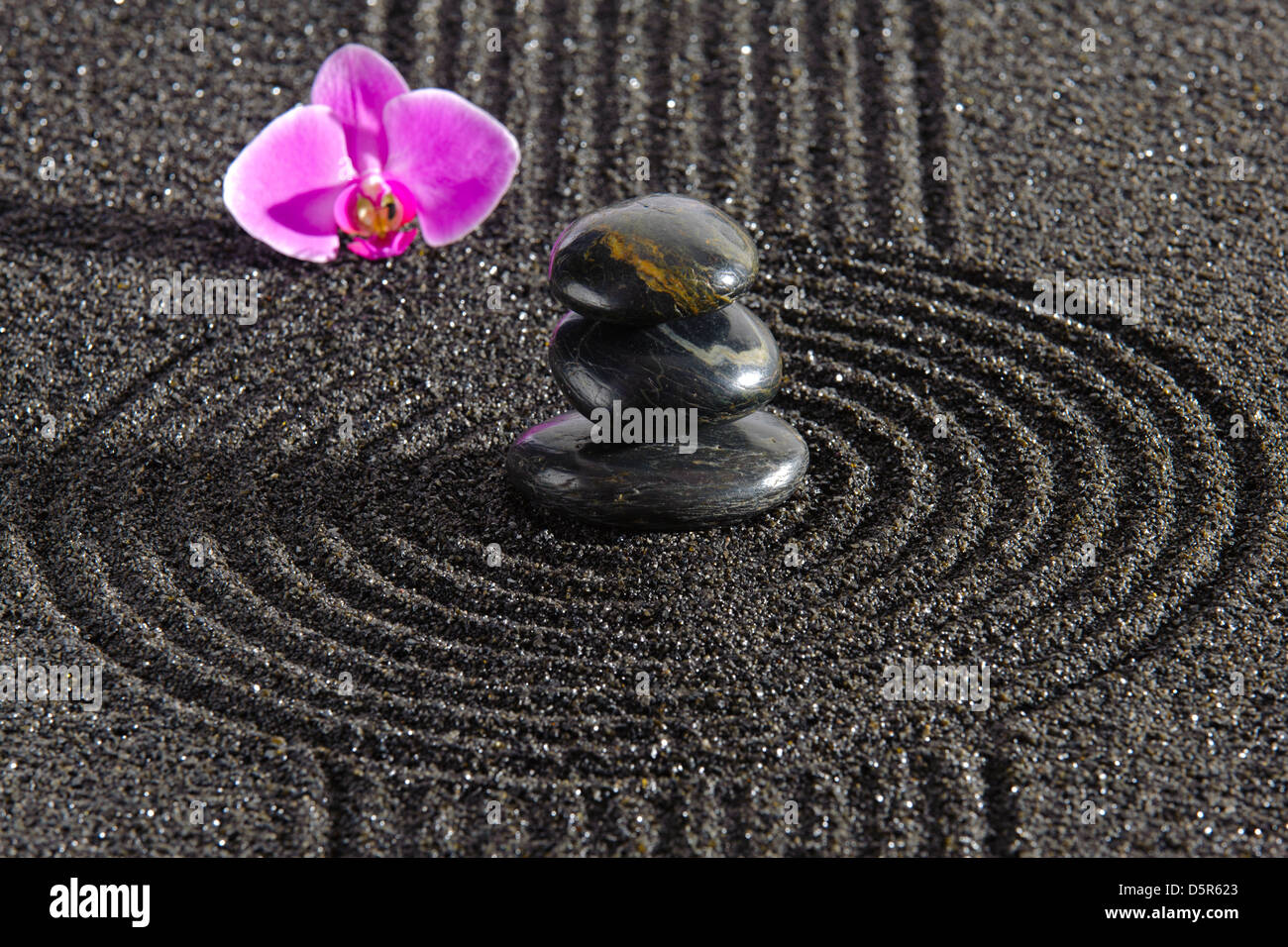 Japan zen garden of meditation with stone and structure in sand Stock Photo