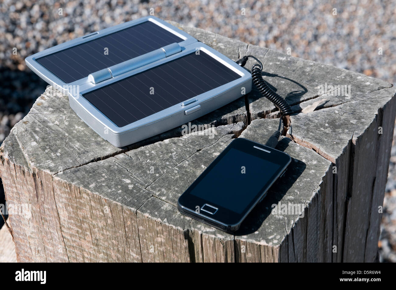 mobile phone solar powered battery charger Stock Photo - Alamy