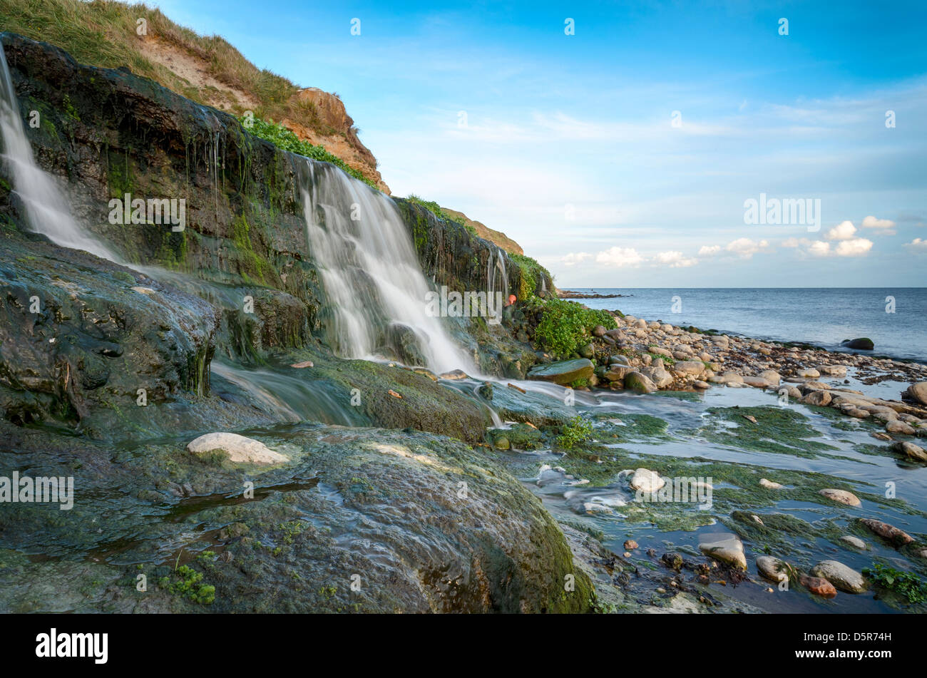The beach and waterfall at Osmington Mills near Weymouth on Dorset's Jurassic Coast Stock Photo