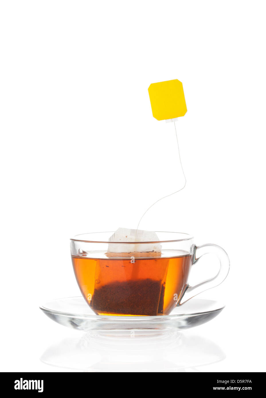 Hot tea in transparent glass cup with label Stock Photo
