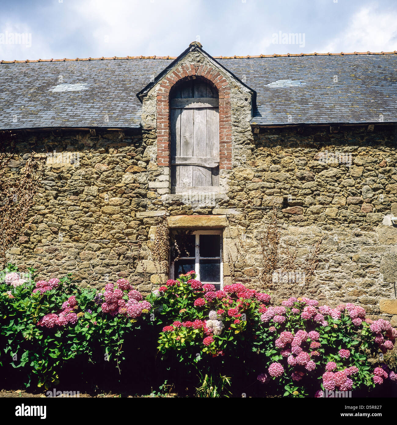 Flowered farm house Brittany France Stock Photo