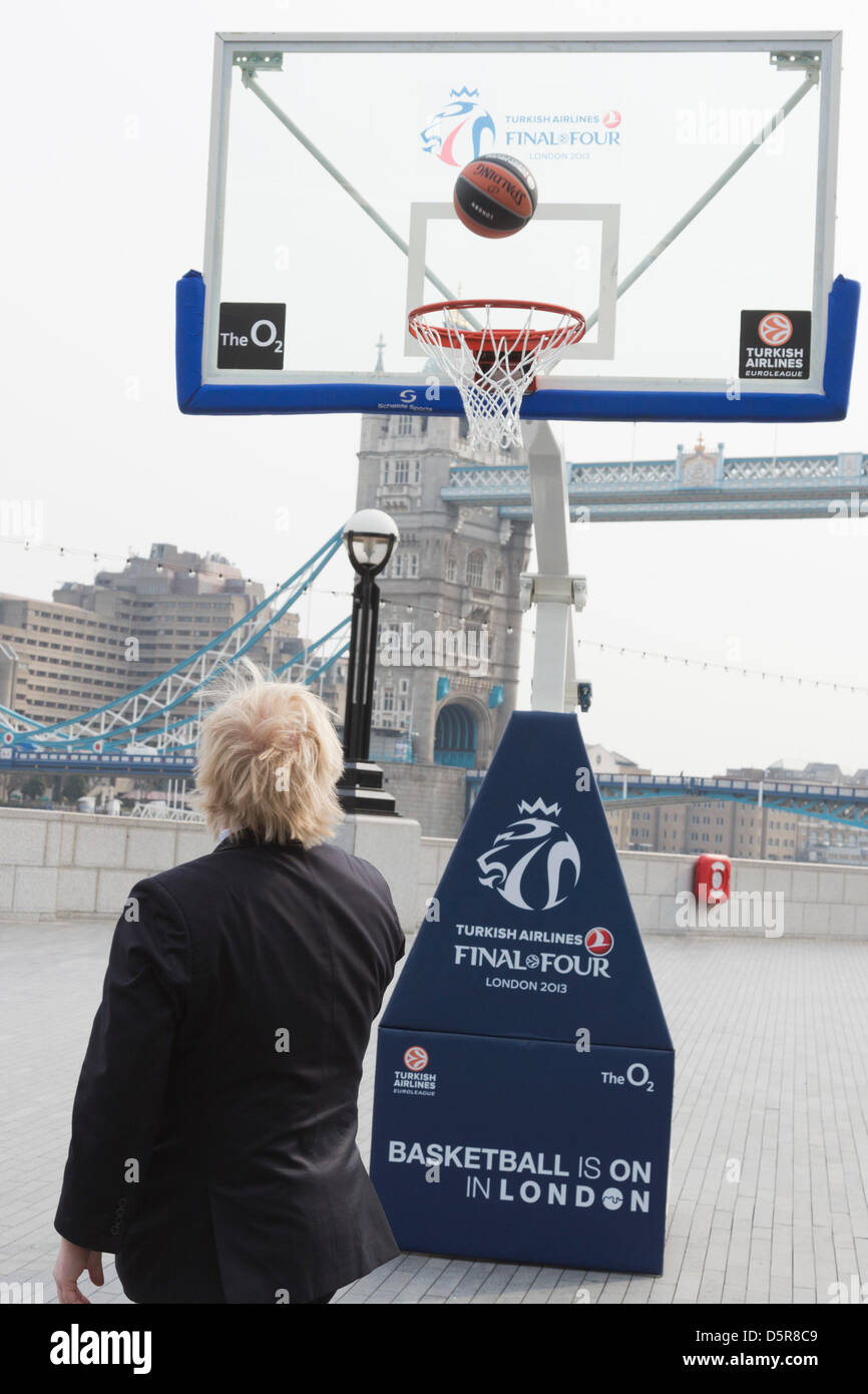 London, UK. 8th April 2013. Sequence: Boris Johnson attemps an overhead shot at the basket and scores. London Mayor Boris Johnson promotes the 2013 Turkish Airlines Euroleague Final Four Basketball event to be played at the O2 from 10-12 May 2013, and to reveal the programme of free activities that will take place in conjunction with the event to get Londoners involved with basketball. Credit: Nick Savage/Alamy Live News Stock Photo