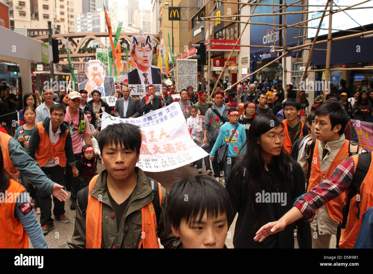 Causeway Bay, Hong Kong. 7th April 2013. Boy fronts march to support striking Hong Kong dockers. Credit: Robert SC Kemp/Alamy Live News Stock Photo