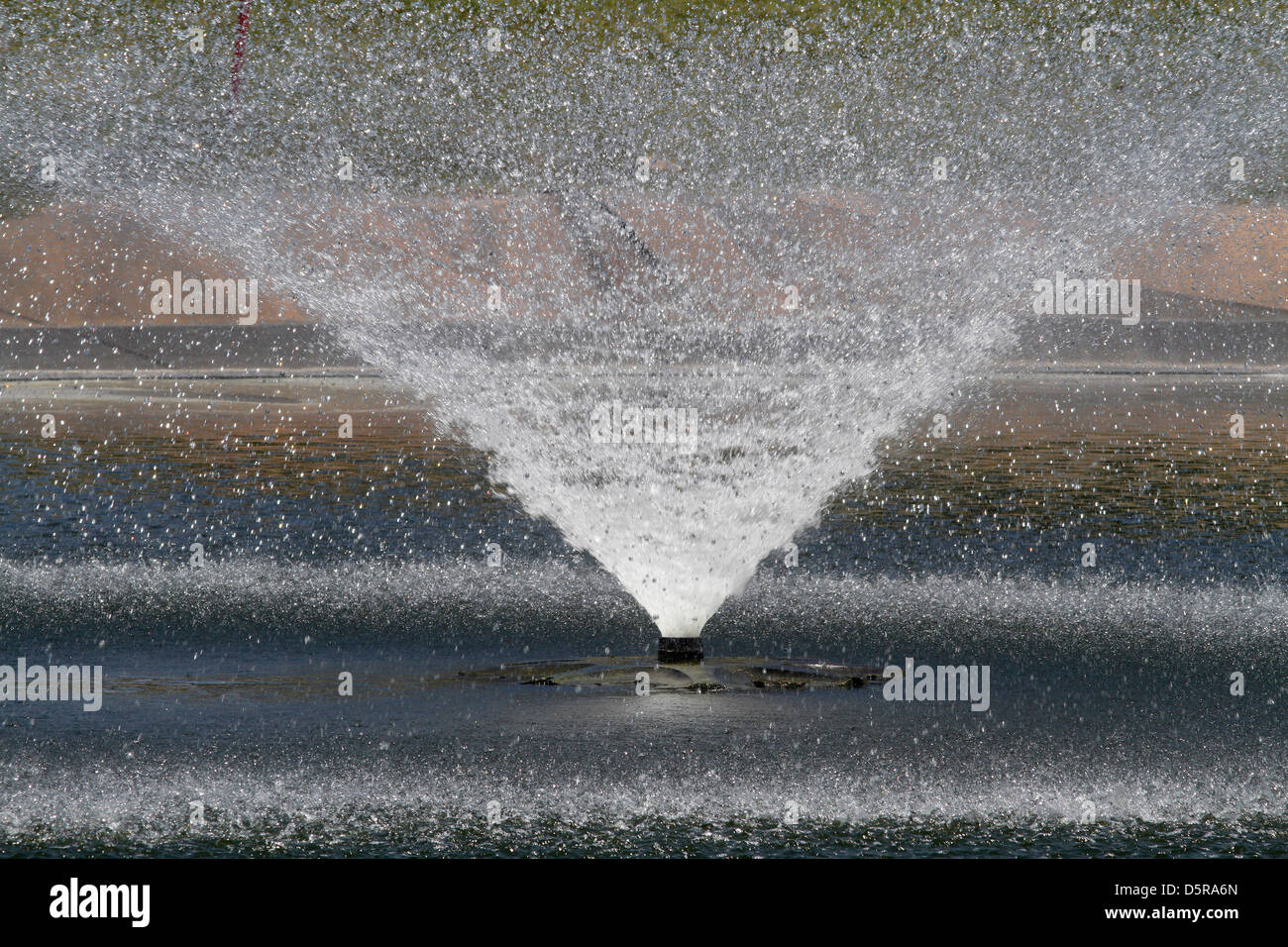 Fountain water jet in a park in the Spanish island of Majorca Stock Photo