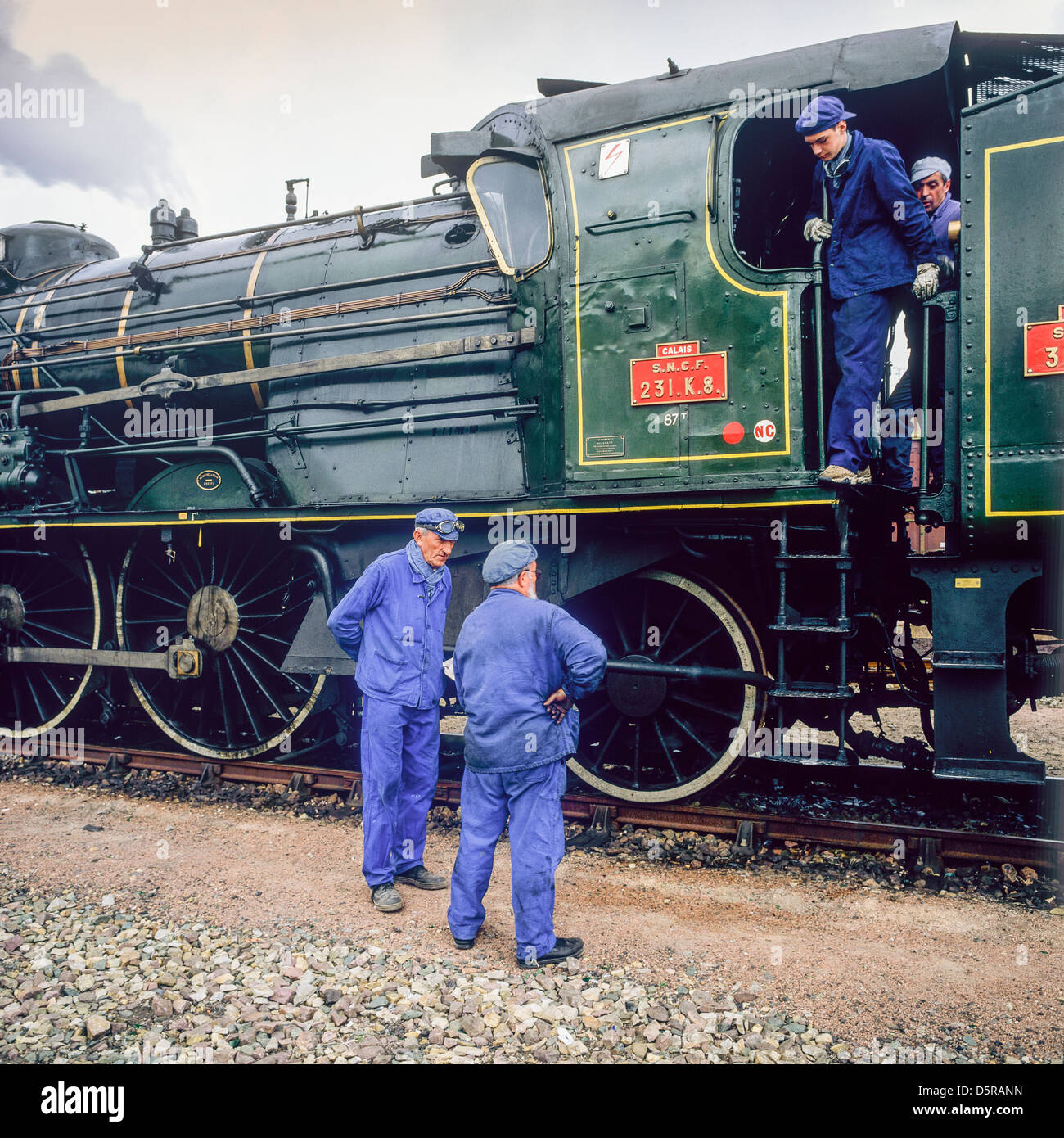 Engineers with historic steam locomotive 'Pacific PLM 231 K 8' of 'Paimpol-Pontrieux' train Brittany France Europe Stock Photo