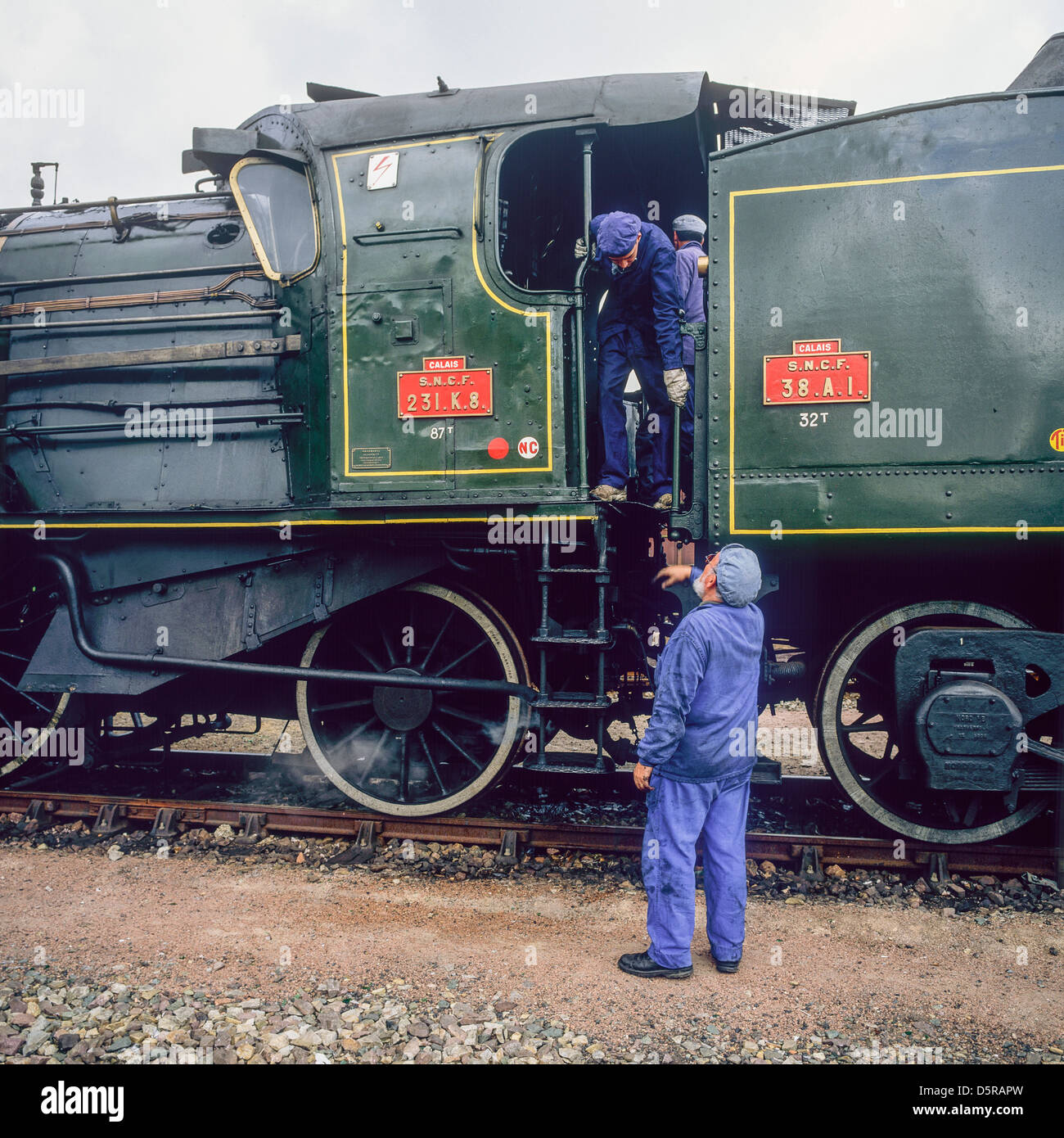 Engineers with historic steam locomotive 'Pacific PLM 231 K 8' of 'Paimpol-Pontrieux' train Brittany France Stock Photo