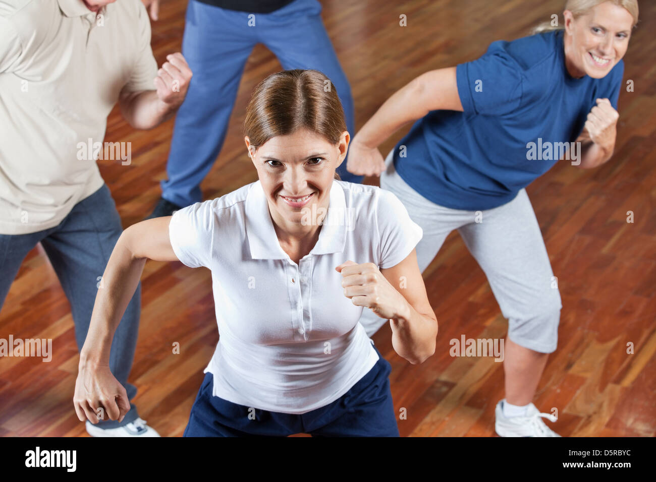 Happy senior group dancing in fitness center class Stock Photo