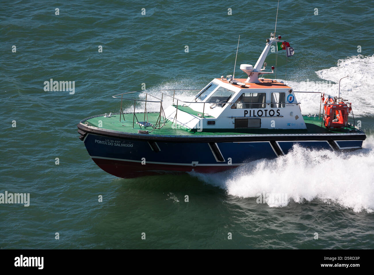 high speed pilot launch coming alongside passenger ship. Lisbon