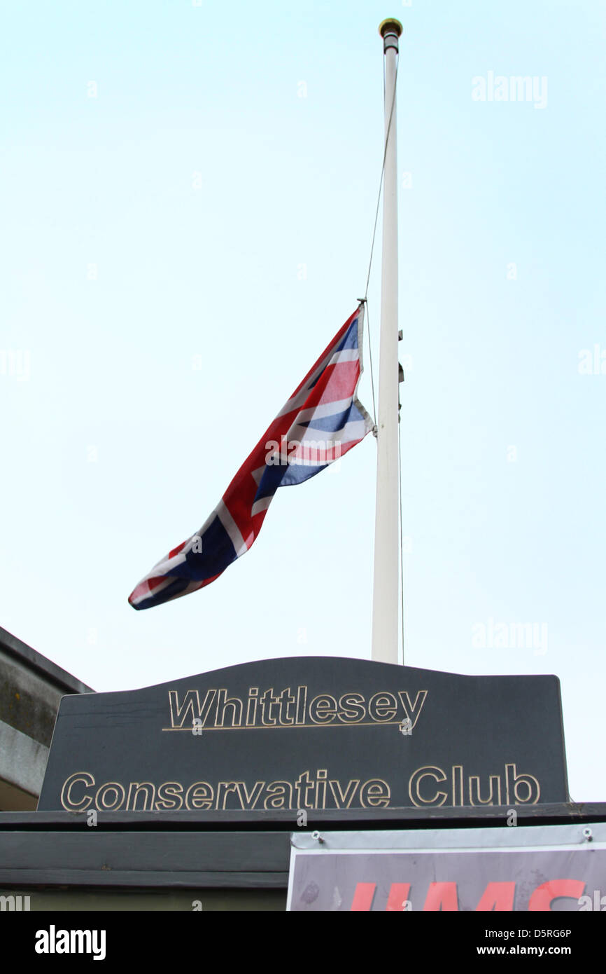 Whittlesey, Cambridgeshire, UK. 8th April 2013. Death of Margaret Thatcher announced       Flag flies at halfmast,       April 8, 2013            As soon as the death of former Prime Minister Baroness Margaret (Maggie) Thatcher, was announced, Kim Ingram, manager of the Conservative Club in Whittlesey, Cambridgeshire, got staff member Steve Purvis to lower the Union Flag to halfmast. Pic: Paul Marriott Photography/Alamy Live News Stock Photo