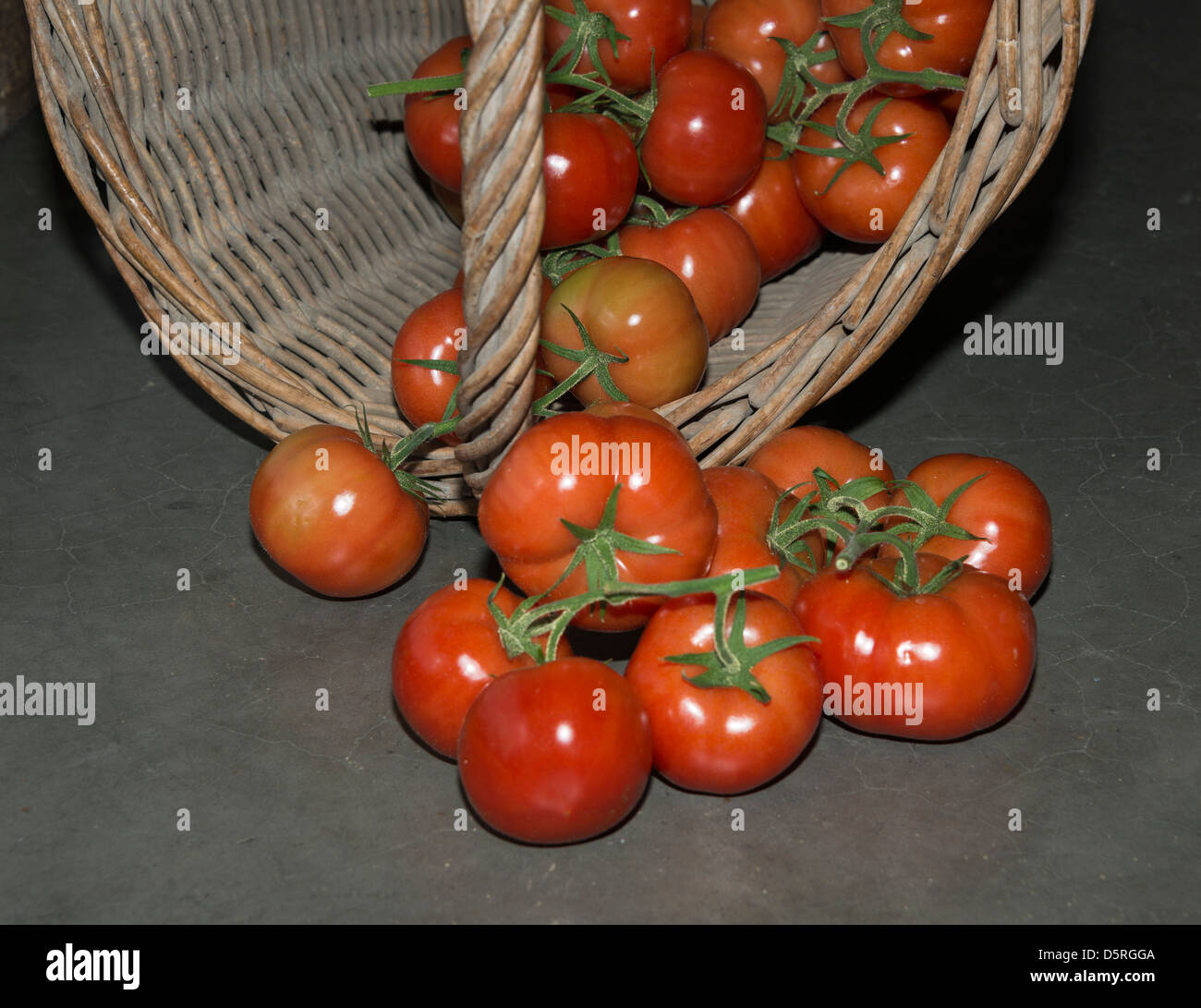 rattan basket with red tomato Stock Photo