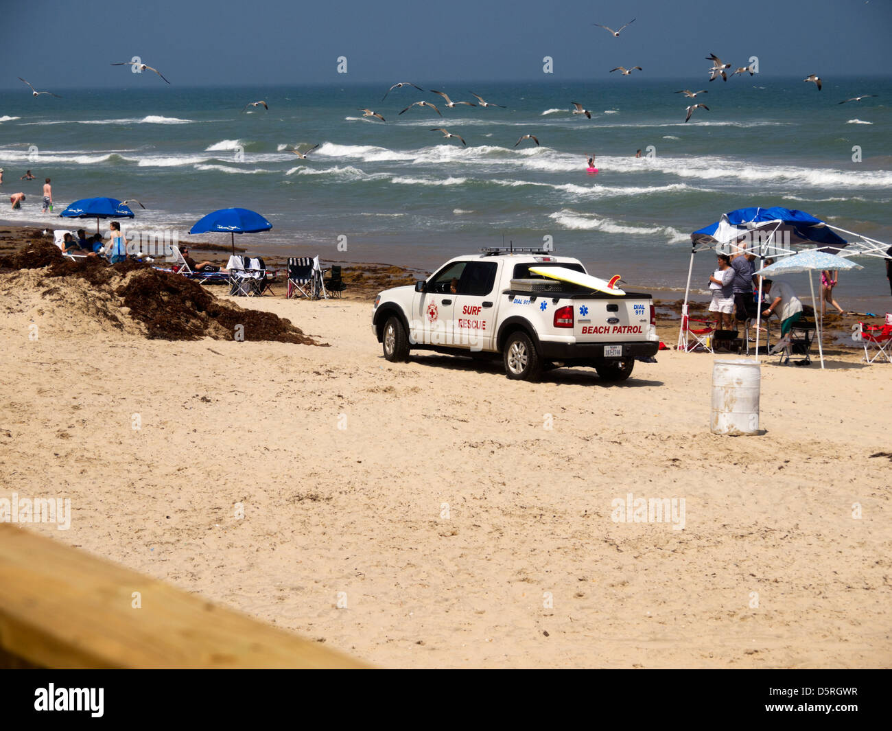Beach Patrol at South Padre Island, Texas. Real people relaxing on the beach and swimming in the Gulf of Mexico. Stock Photo