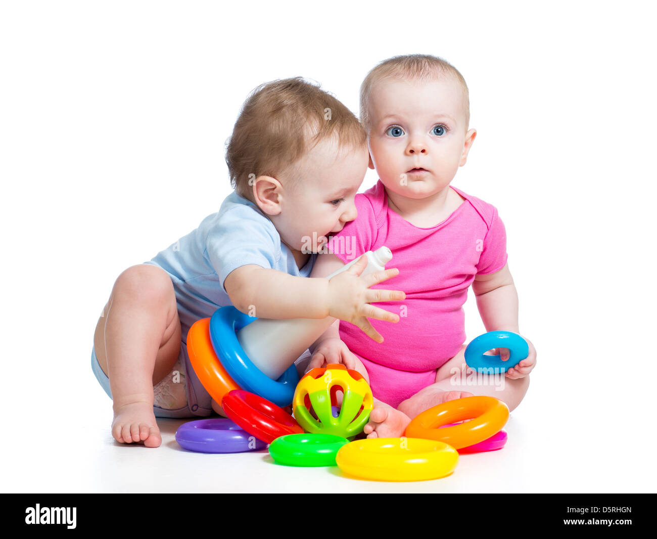 kids boy and girl playing toys together Stock Photo