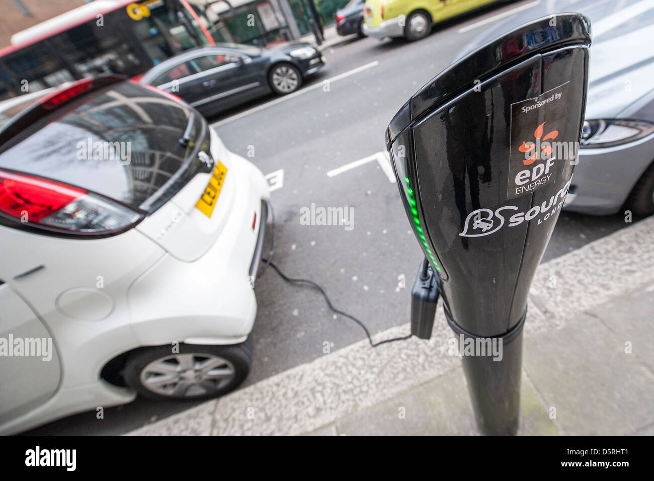 An electric car is charged outside the Department for Transport, Horseferry Road, London, UK 08 April 2013 Stock Photo