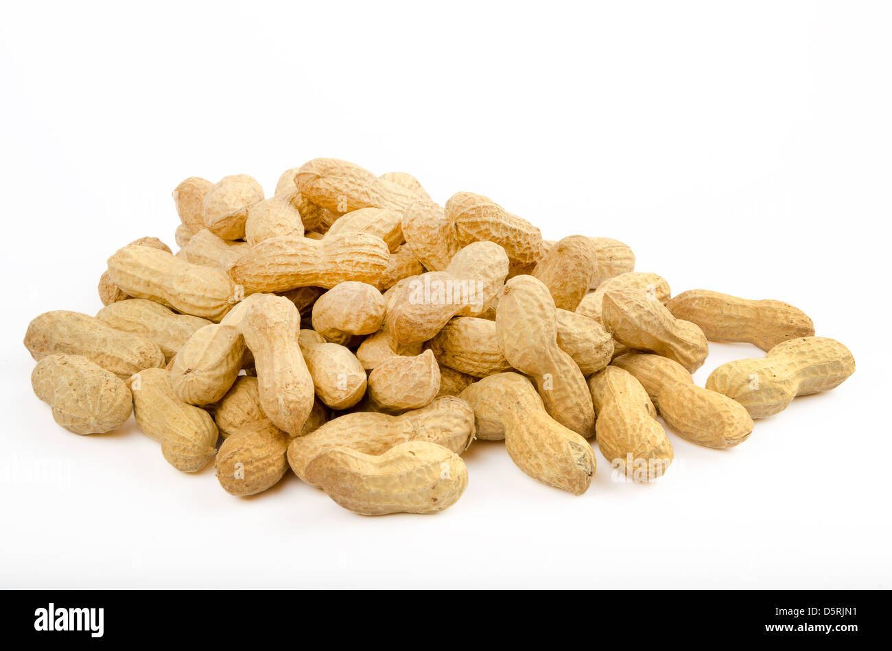 Many peanuts in shells on a white background Stock Photo