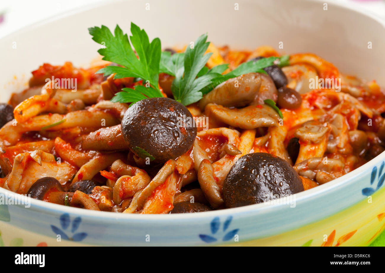 Porcini mushrooms with tomato Stock Photo