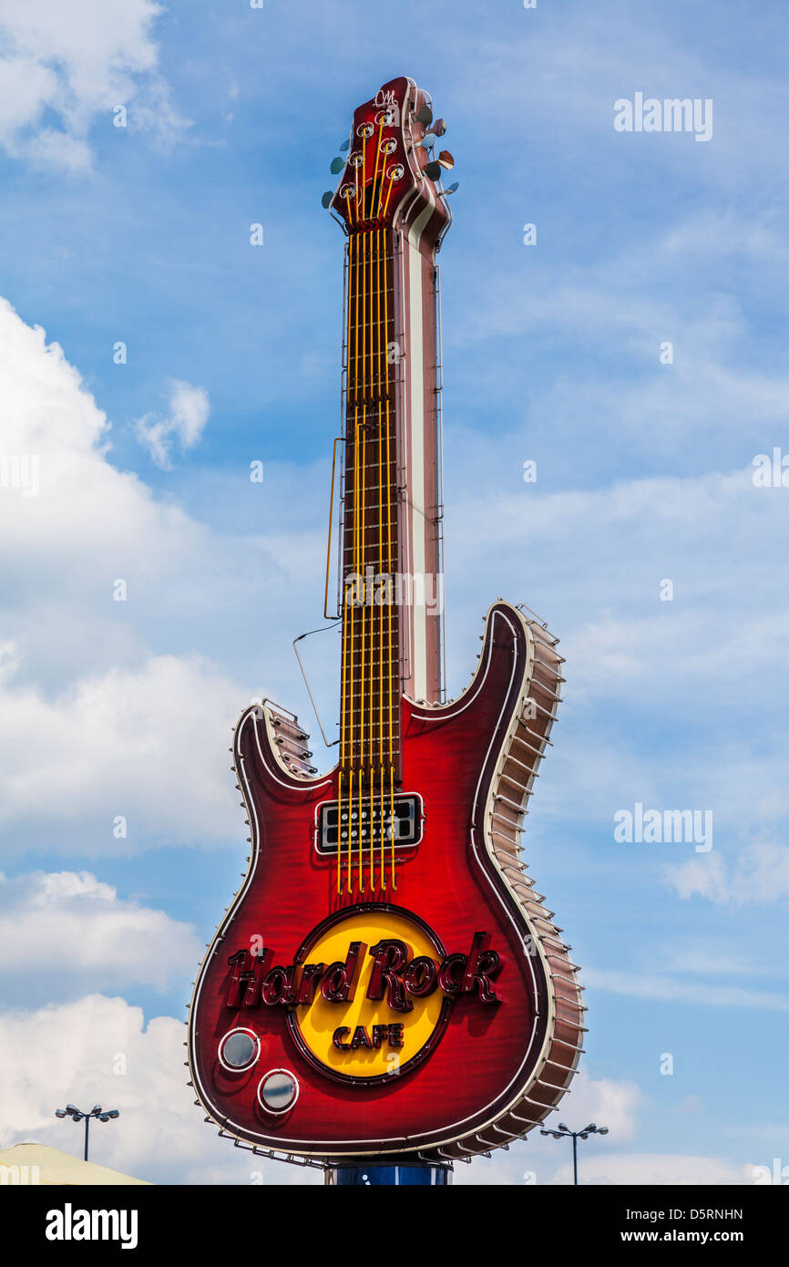 Iconic guitar logo sign of the Hard Rock Cafe at Zlote Tarasy in Warsaw, Poland. Stock Photo