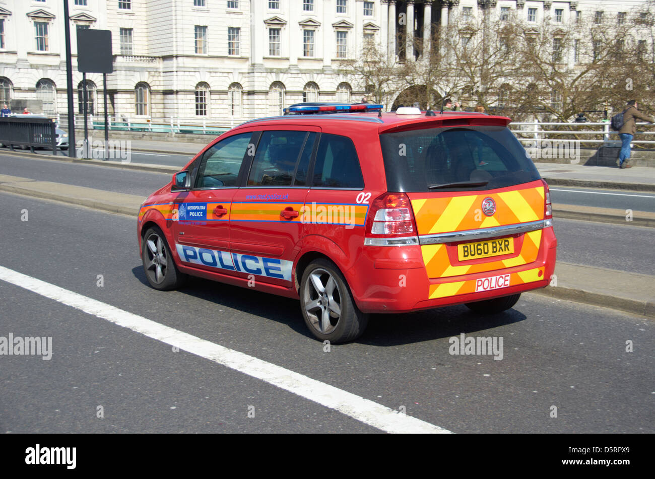 Red Diplomatic Protection unit Police car in London (going over Waterloo Bridge). Stock Photo