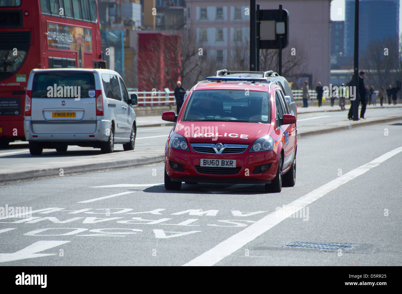 Red Diplomatic Protection unit Police car in London (going over Waterloo Bridge). Stock Photo