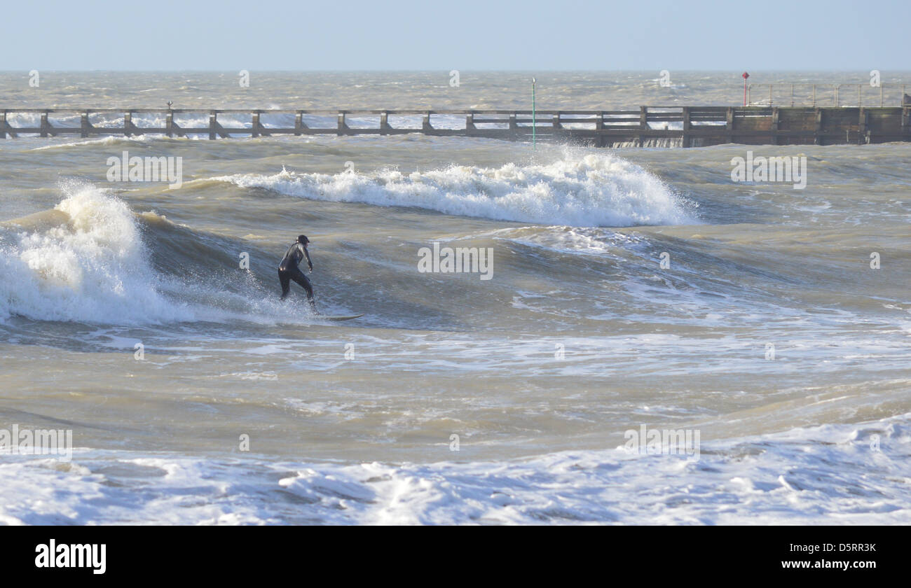 Winter Surfing in the sea off Littlehampton, West Sussex, England Stock Photo