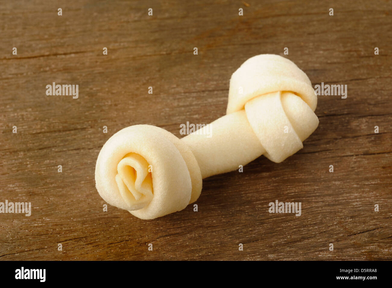 Bone toy for dogs on wooden background Stock Photo
