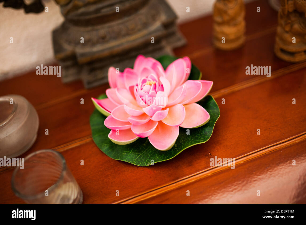 A lotus flower candle, which is associated with purity and beauty. Stock Photo