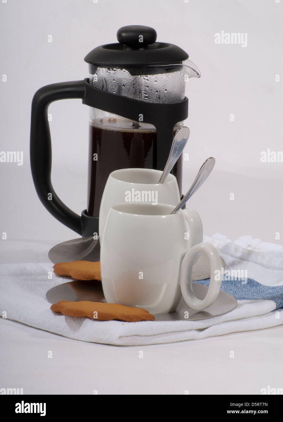 Coffee,traditional French press coffee maker and small white cups with
