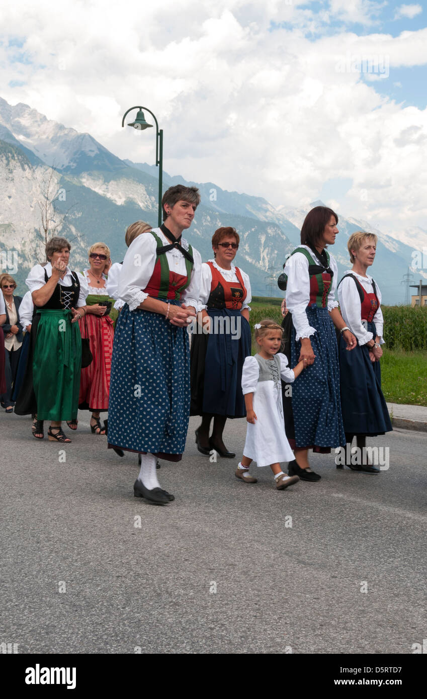 people walking in procession to the church on Maria Ascension,on August 15, 2012 in Axams, Austria Stock Photo