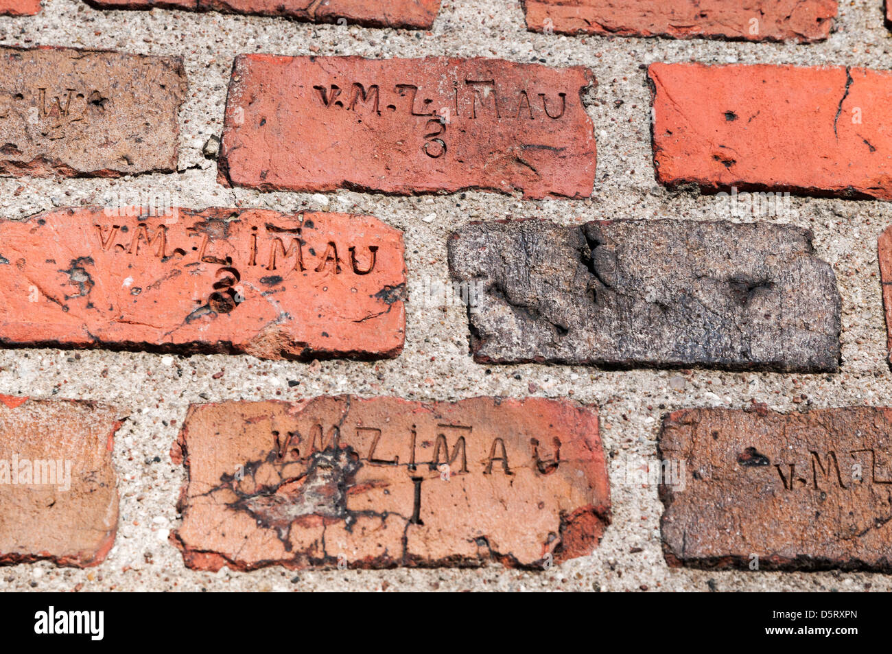 Old weathered red brick wall with stamp Stock Photo Alamy