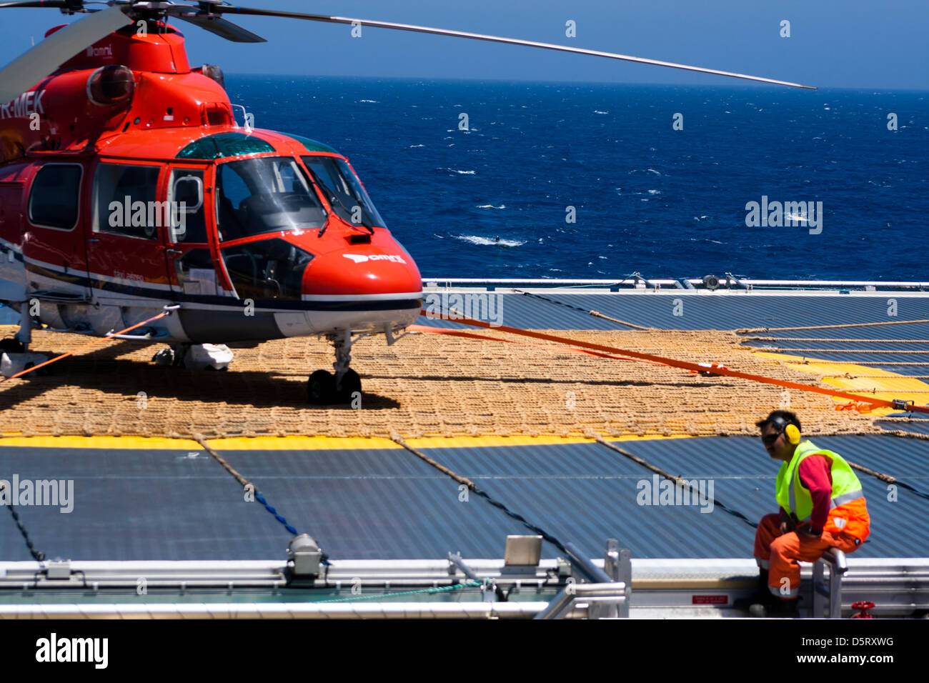 helicopter landed in the landing deck of seismic vessel Ramform Sovereign  from PGS oil exploration company Stock Photo - Alamy