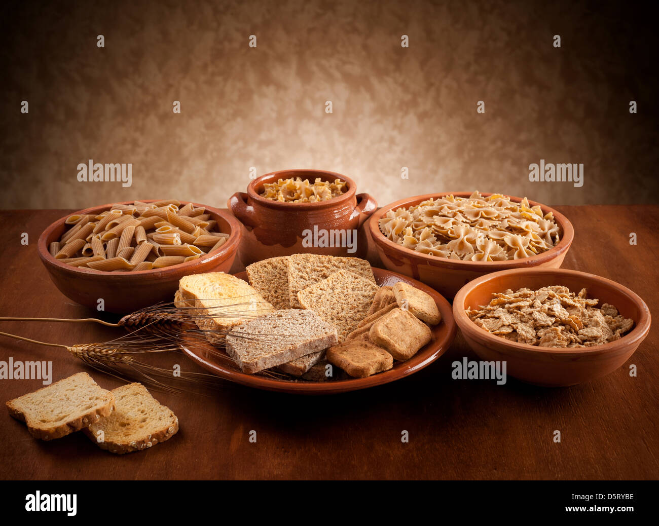 Whole grain carbohydrates on wooden table Stock Photo