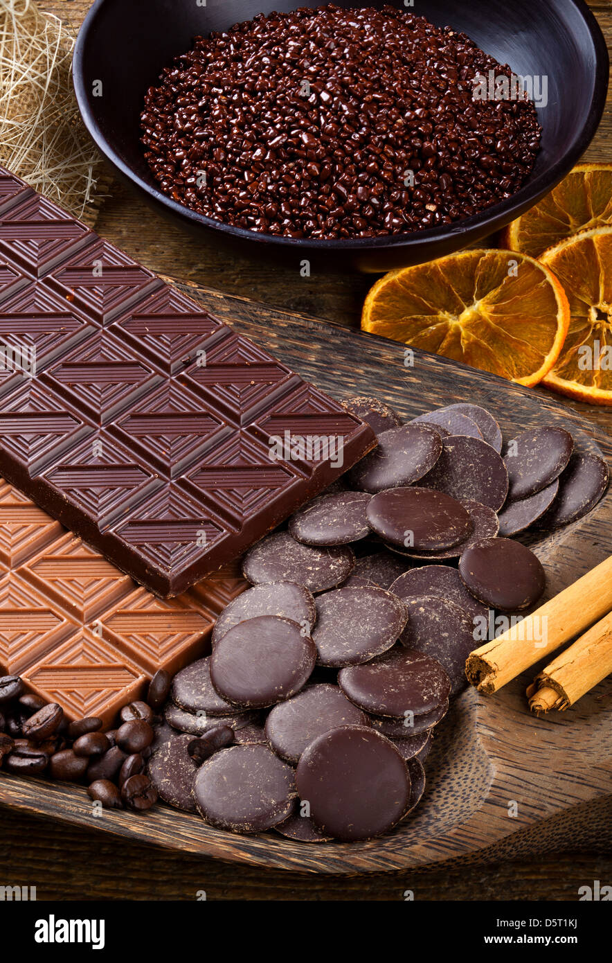Chocolate with sliced dried orange and cinnamon sticks. Stock Photo